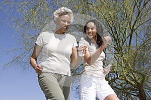Mother And Daughter Jogging Together