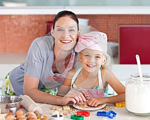 Mother and daughter Kitchen Smiling at Camera