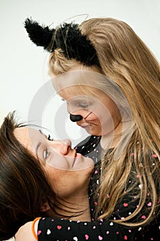 Mother with daughter in kitten costume