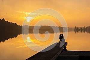 Mother & Daughter Lake Sunrise Kiss