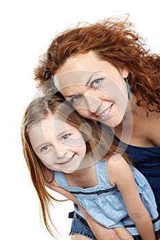 Mother and daughter lean together slightly forward photo