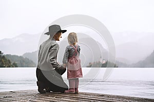 Mother and daughter looking at beautiful Lake Bled