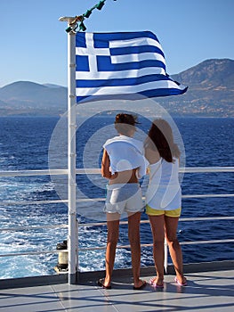 Mother and Daughter Looking Over Stern of Greek Island Ferry