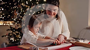 mother and daughter making gingerbread at home