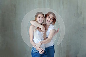 Mother and daughter near the windiow photo