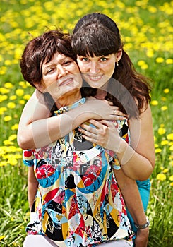 Mother with daughter in outdoor.