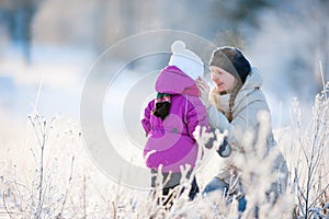 Mother and daughter outdoors on winter day