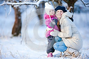 Mother and daughter outdoors on winter day
