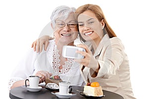 Mother and daughter photographing themselves