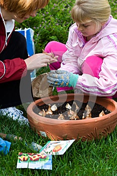 Mother and daughter planting