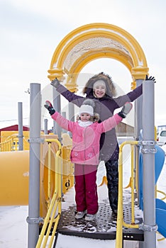 Mother and daughter on the playground