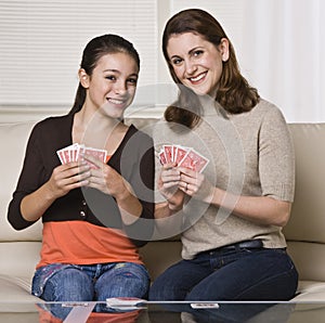 Mother and Daughter Playing Cards