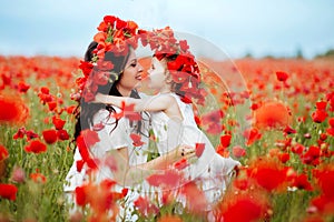 Mother and daughter playing in flower field