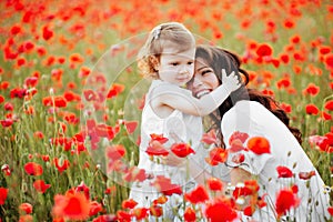 Mother and daughter playing in flower field