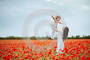 Mother and daughter playing in flower field