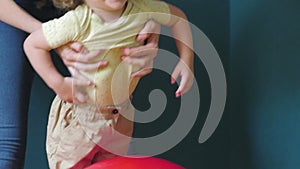 Mother and daughter playing with Gym Ball