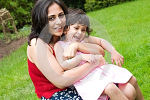 Mother and daughter playing outside