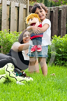 Mother and daughter playing outside