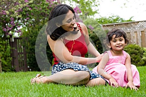 Mother and daughter playing outside