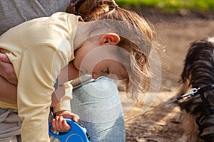 Mother and daughter playing together in the park. Concept of happy family