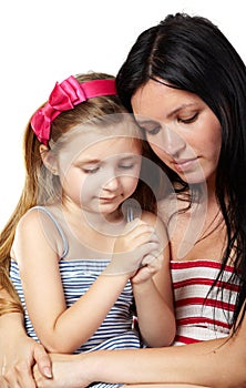 Mother and daughter pray