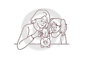 Mother and daughter put coin in piggybank