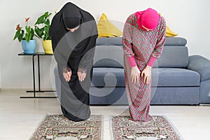 Mother and daughter read Namaz