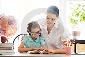 Mother and daughter are reading a book