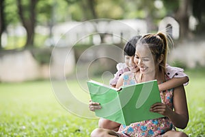 Mother and daughter reading a fairytale to her daughter