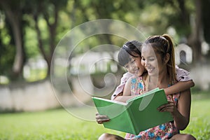 Mother and daughter reading a fairytale to her daughter