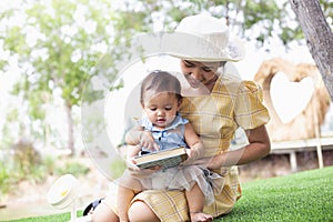 Mother and daughter relax and read a book