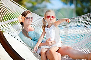 Mother and daughter relaxing in hammock