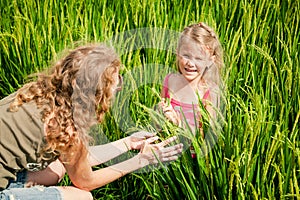 Mother and daughter on the rice paddies photo