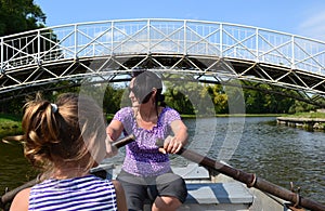 Mother and daughter in a rowboat