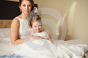 Mother and daughter in the same wedding dresses