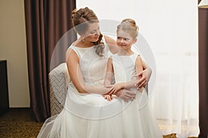 Mother and daughter in the same wedding dresses
