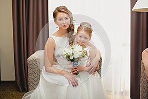 Mother and daughter in the same wedding dresses