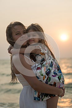 Mother and daughter at the sea