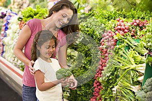 Mother and daughter shopping for fresh produce