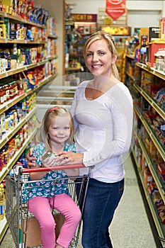 Mother And Daughter Shopping In Supermarket