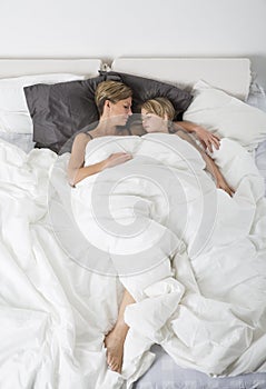 Mother and daughter sleeping from high angle view