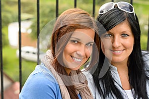 Mother and daughter smiling relaxing and bonding