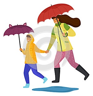 Mother and daughter spend time together on a rainy day move down the street isolated on white