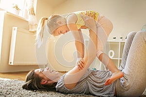 Mother and daughter spending free time together at home.