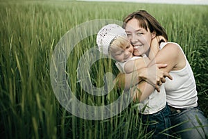 Mother with daughter in spring field