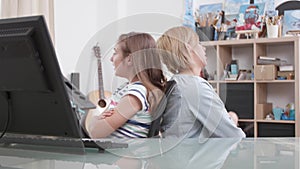 Mother and daughter standing back to back arguing for school grades