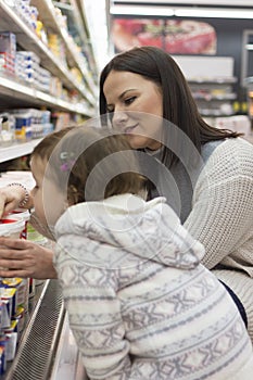 Family buying groceries in the local supermarket