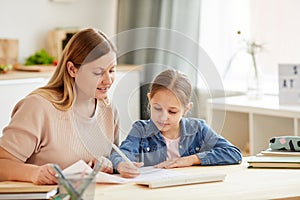 Mother and Daughter Studying at Home photo