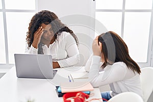 Mother and daughter studying and working at home