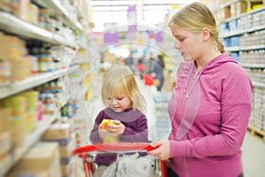 Mother and daughter in supermarket